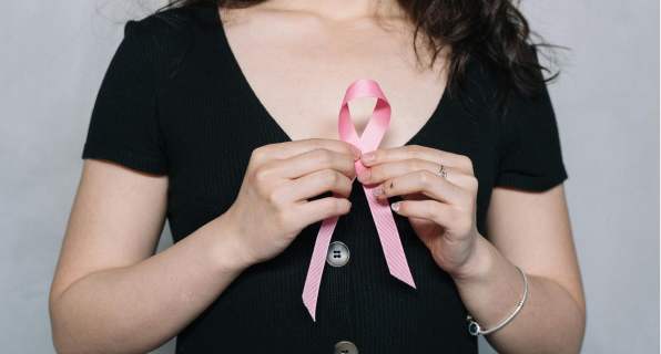 women holding breast cancer pink ribbon